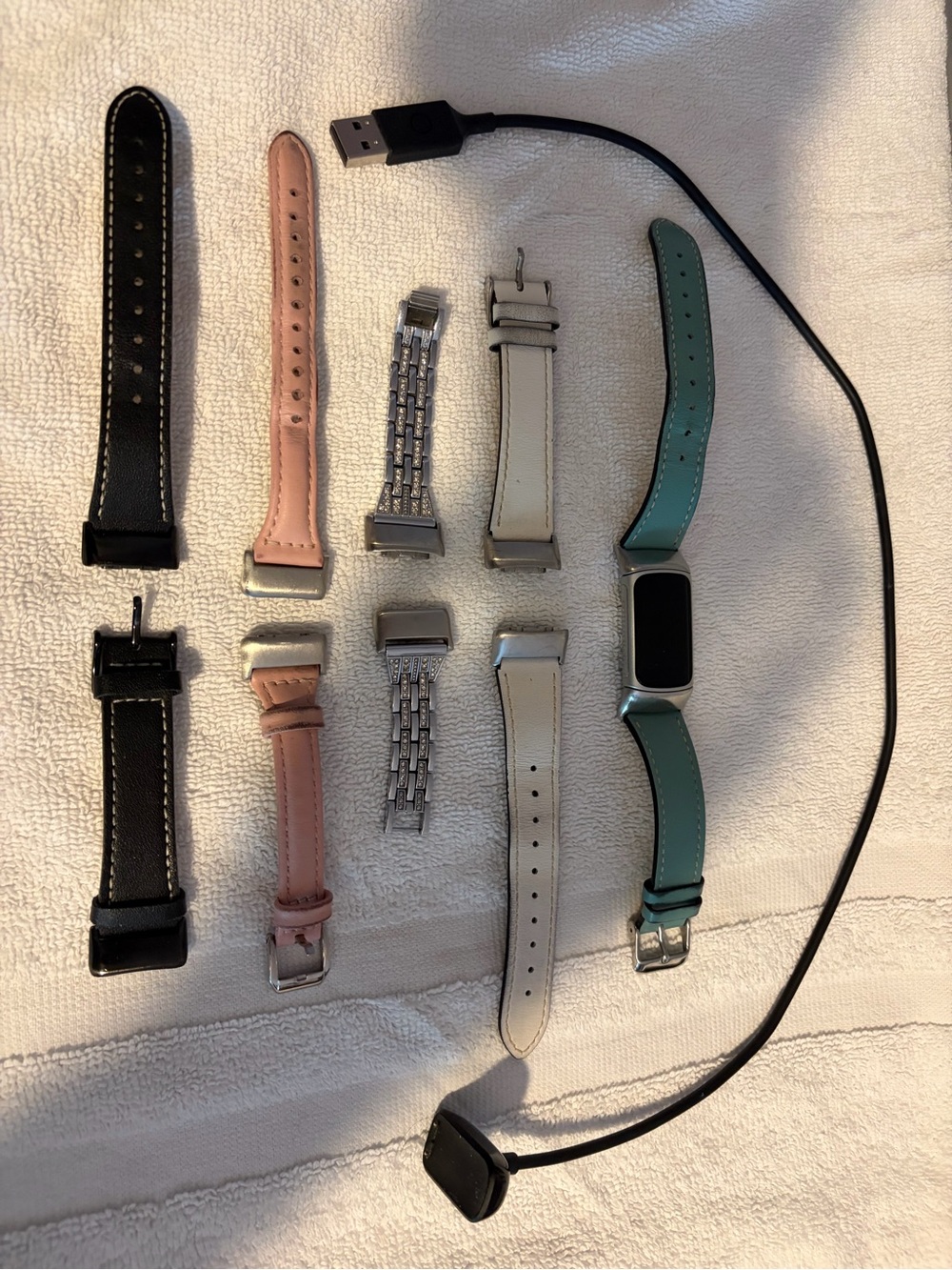 Fitbit Charge 5 including Watch Band Set (5). Also includes charger wire.